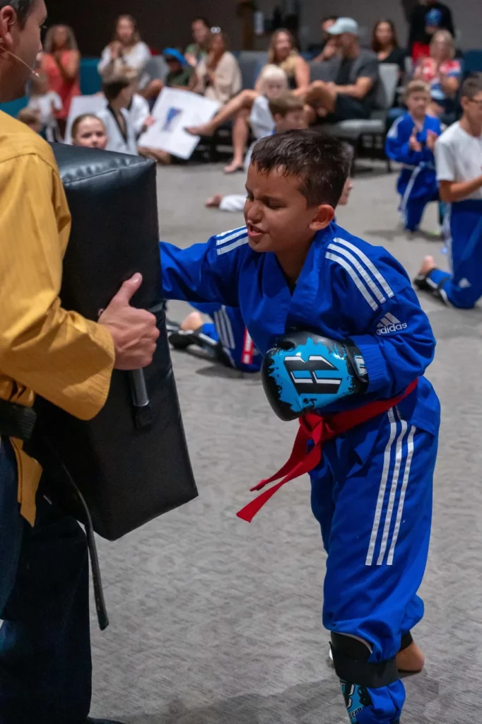 Happy teens in Lakewood Ranch learning martial arts, improving balance, coordination, and having fun while building life skills.